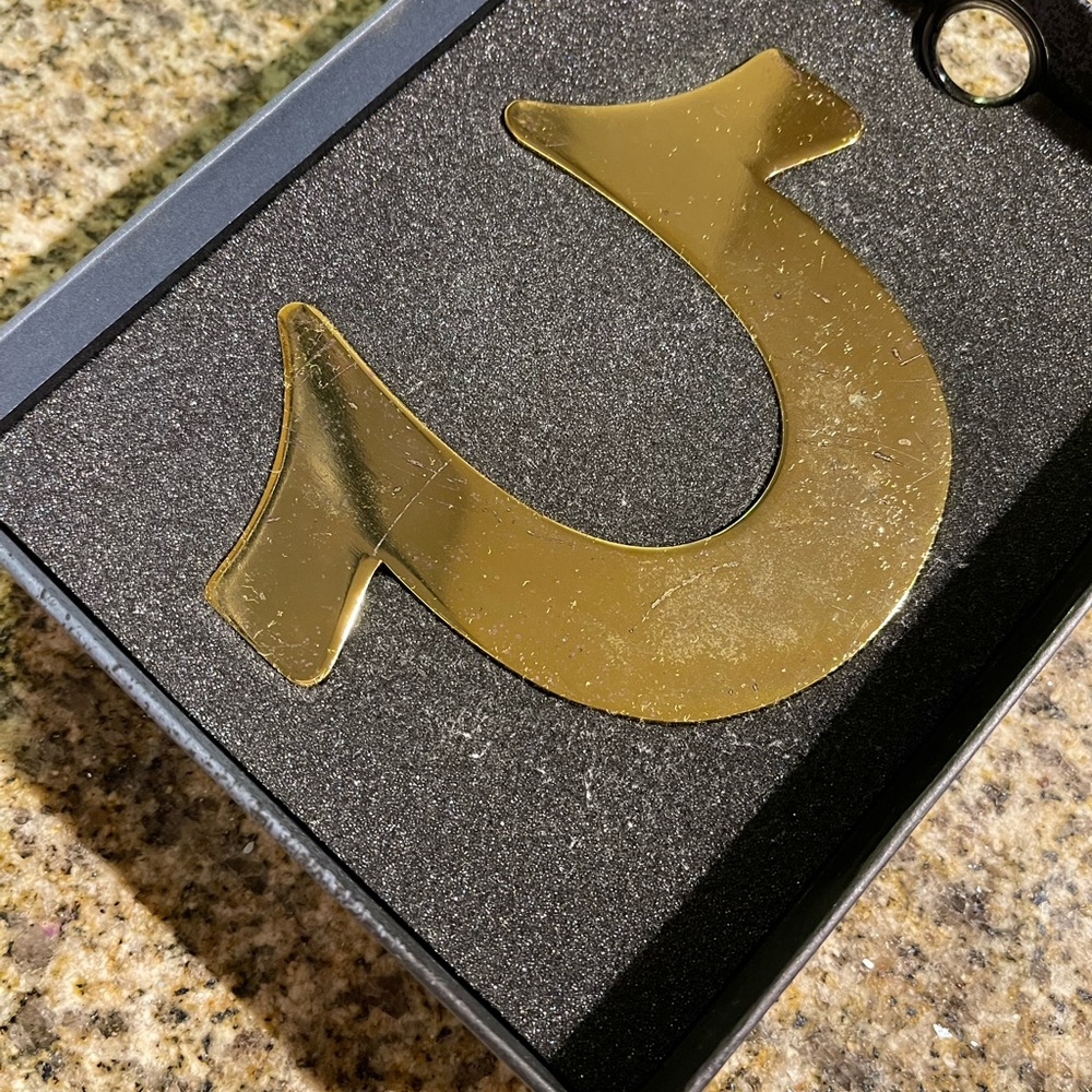 True religion collectible paper weight